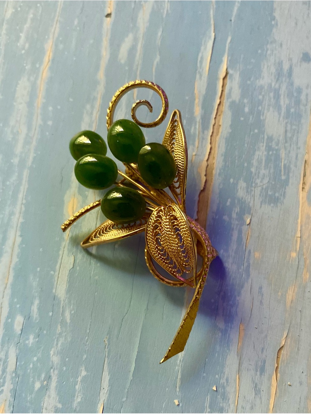 Gold Tone Floral Brooch with Green Bead Accents